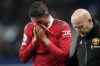 Manchester United's Raphael Varane, left, reacts as he leaves the field after he was injured during the English Premier League soccer match between Manchester United and Chelsea at the Stamford Bridge Stadium in London, Saturday, Oct. 22, 2022. (AP Photo/Frank Augstein)