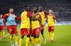 Lens' David Costa, center, celebrates after scoring the opening goal during the French League One soccer match between Marseille and Lens at the Velodrome stadium in Marseille, southern France, Saturday, Oct. 22, 2022. (AP Photo/Daniel Cole)