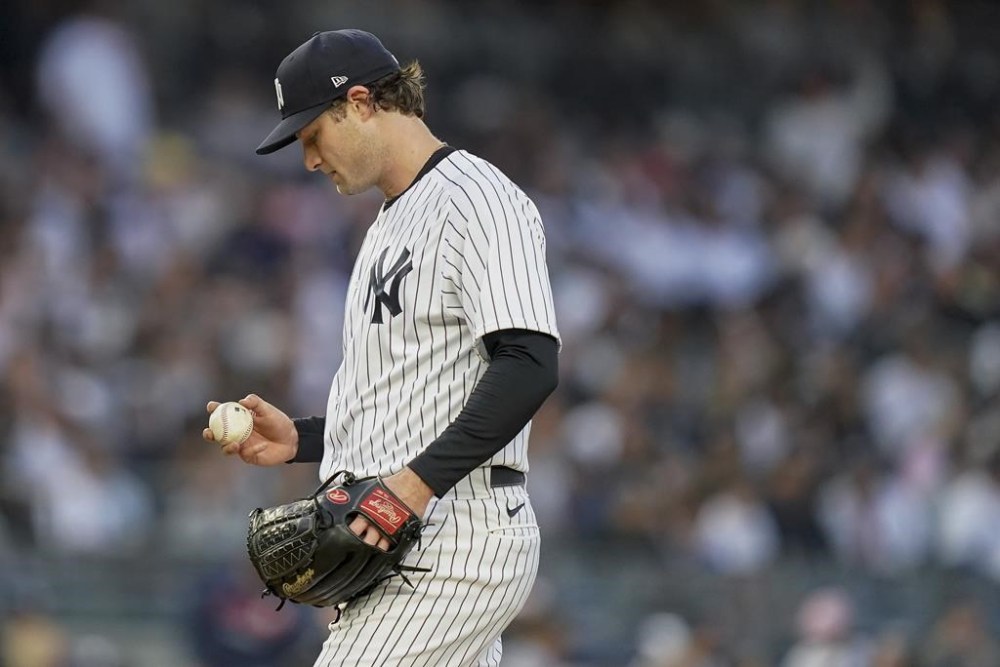 New York Yankees starting pitcher Gerrit Cole reacts after giving up a two-run home run against the Houston Astros during the second inning of Game 3 of an American League Championship baseball series, Saturday, Oct. 22, 2022, in New York. (AP Photo/John Minchillo)