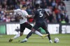 Southampton's Mohamed Elyounoussi, left, and Arsenal's Thomas Partey fight for the ball during the English Premier League soccer match between Southampton and Arsenal at the Saint Mary's Stadium in Southampton, Sunday, Oct. 23, 2022. (AP Photo/David Cliff)