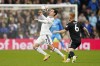 Leeds United's Brenden Aaronson, left, and Fulham's Harrison Reed battle for the ball during the English Premier League soccer match between Leeds United and Fulham at Elland Road, Leeds, England, Sunday Oct. 23, 2022. (Danny Lawson/PA via AP)
