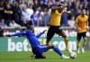 Leicester City's Boubakary Soumare, left, and Wolverhampton Wanderers' Adama Traore battle for the ball during the English Premier League soccer match between Leicester City and Wolverhampton Wanderers at the Molineux stadium, in Wolverhampton, England, Sunday Oct. 23, 2022. (Nick Potts/PA via AP)