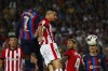 Barcelona's Ousmane Dembele, top left, attempts a head at goal to scores his side's opening goal during a Spanish La Liga soccer match between Barcelona and Athletic Club at the Camp Nou stadium in Barcelona, Spain, Sunday, Oct. 23, 2022. (AP Photo/Joan Monfort)