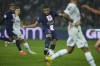 PSG's Kylian Mbappe,centre, shots on target during the French League One soccer match between Paris Saint-Germain and Marseille at the Parc des Princes in Paris, Sunday, Oct. 16, 2022. (AP Photo/Thibault Camus)