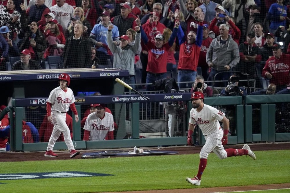 Philadelphia Phillies' Kyle Schwarber celebrates his home run during the first inning in Game 3 of the baseball NL Championship Series between the San Diego Padres and the Philadelphia Phillies on Friday, Oct. 21, 2022, in Philadelphia. (AP Photo/Matt Rourke)
