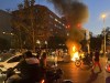 In this Monday, Sept. 19, 2022, photo taken by an individual not employed by the Associated Press and obtained by the AP outside Iran, a police motorcycle and a trash bin are burning during a protest over the death of Mahsa Amini, a 22-year-old woman who had been detained by the nation's morality police, in downtown Tehran, Iran. Spontaneous mass gatherings to persistent scattered demonstrations have unfolded elsewhere in Iran, as nationwide protests over the death of a young woman in the custody of the morality police enter their fourth week.(AP Photo)