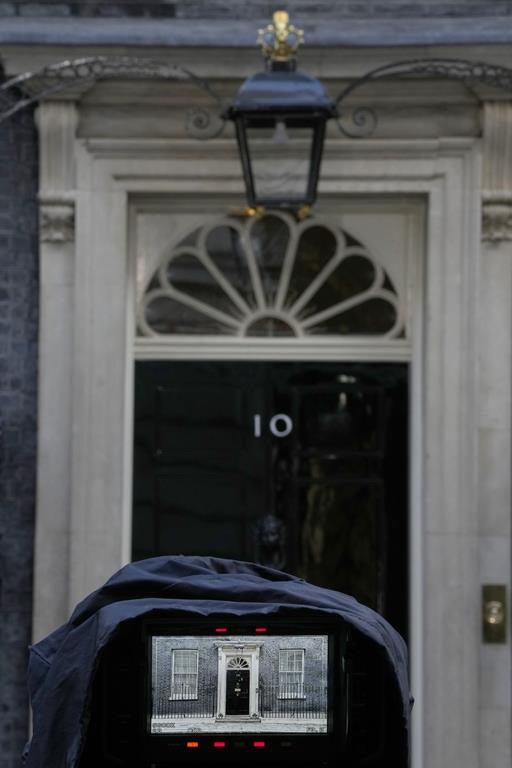 Number 10, Downing Street as seen through the lens of a television camera waiting outside the office in London, Monday, Oct. 24, 2022. Former British Treasury chief Rishi Sunak is frontrunner in the Conservative Party's race to replace Liz Truss as prime minister. (AP Photo/Alastair Grant)