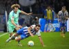 Schalke's Alex Kral, left, vies for the ball with Hertha's Lucas Tousart, during the German Bundesliga soccer match between Hertha Berlin and FC Schalke 04, in Berlin, Sunday, Oct. 23, 2022. (Soeren Stache/dpa via AP)