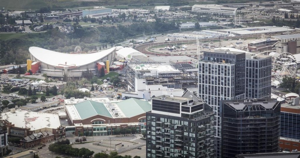 A view of the Calgary Stampede grounds and the Saddledome seen from the Telus Sky building in Calgary, Alta., Wednesday, July 6, 2022. Alberta's premier has stated her support for a new arena in Calgary to house the NHL's Flames and wants the province to get involved. THE CANADIAN PRESS/Jeff McIntosh