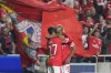 Benfica's Rafa Silva, left, is congratulated by teammate Joao Mario after scoring his team's third goal during the Champions League group H soccer match between SL Benfica and Juventus at the Luz stadium in Lisbon, Tuesday, Oct. 25, 2022. (AP Photo/Armando Franca)