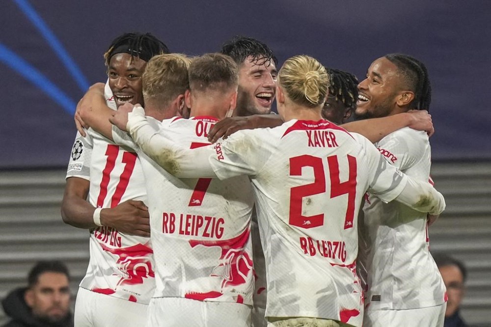 Leipzig's Timo Werner celebrates after scoring his side's third goal with his teammates during the group F Champions League soccer match between RB Leipzig and Real Madrid at the RB Arena in Leipzig, Germany, Tuesday, Oct. 25, 2022. (AP Photo/Matthias Schrader)