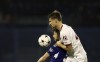AC Milan's Matteo Gabbia, top, duels for the ball with Dinamo's Bruno Petkovic during the Champions League Group E soccer match between Dinamo Zagreb and AC Milan in Zagreb, Croatia, Tuesday, Oct. 25, 2022. (AP Photo)