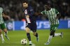 PSG's Lionel Messi, left, challenges for the ball with Maccabi's Ali Mohamed, during the Champions League Group H soccer match between Paris Saint Germain and Maccabi Haifa, at the Parc des Princes stadium, in Paris, France, Tuesday, Oct. 25, 2022. (AP Photo/Christophe Ena)