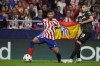 Atletico Madrid's Reinildo Mandava, left, and Leverkusen's Adam Hlozak challenge for the ball during the group B Champions League soccer match between Atletico Madrid and Bayer 04 Leverkusen at the Civitas Metropolitano stadium in Madrid, Spain, Wednesday, Oct. 26, 2022. (AP Photo/Manu Fernaandez)