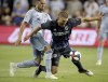 FILE -Sporting Kansas City midfielder Benny Feilhaber, left, and LA Galaxy defender Perry Kitchen chase the ball during the second half of an MLS soccer match Wednesday, May 29, 2019, in Kansas City, Kan. Midfielder Perry Kitchen is retiring at age 30 after nine years in Major League Soccer and a season as captain of Scotland's Heart of Midlothian, Wednesday, Oct.26, 2022. (AP Photo/Charlie Riedel, File)