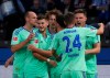 Schalke's goal scorer Marius Bulter , background right, celebrates with teammates, during the German Bundesliga soccer match between Hertha Berlin and FC Schalke 04, in Berlin, Sunday, Oct. 23, 2022. (Soeren Stache/dpa via AP)