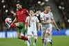 FILE- Portugal's Bernardo Silva controls the ball next to North Macedonia's Milan Ristovski, right, during the World Cup 2022 playoff soccer match between Portugal and North Macedonia, at the Dragao stadium in Porto, Portugal, Tuesday, March 29, 2022. (AP Photo/Luis Vieira, File)