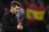 Atletico Madrid's head coach Diego Simeone walks after the group B Champions League soccer match between Atletico Madrid and Bayer 04 Leverkusen at the Civitas Metropolitano stadium in Madrid, Spain, Wednesday, Oct. 26, 2022. (AP Photo/Manu Fernaandez)