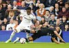 Leeds United's Luis Sinisterra, left, and Fulham's Bobby Decordova-Reid battle for the ball during the English Premier League soccer match between Leeds United and Fulham at Elland Road stadium in Leeds, England, Sunday Oct. 23, 2022. (Danny Lawson/PA via AP)