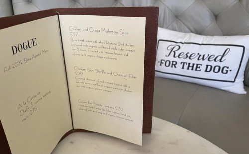 A menu for a multi-course menu is displayed at the Dogue restaurant for dogs in San Francisco, Sunday, Oct. 25, 2022. Dogue, which rhymes with vogue, just opened up in the city's Mission District. For $75 dollars per pup, doggie diners get a multiple-course 