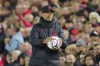 Liverpool's manager Jurgen Klopp holds a ball during the English Premier League soccer match between Liverpool and West Ham United at Anfield stadium in Liverpool, England, Wednesday, Oct. 19, 2022. (AP Photo/Jon Super)