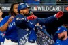 Toronto Blue Jays' Teoscar Hernandez celebrates his second run home of the game with teammate Vladimir Guerrero Jr. during fourth inning American League wild card MLB baseball action against the Seattle Mariners in Toronto on Saturday, October 8, 2022. Outfielders Hernandez and George Springer are two of six Toronto Blue Jays named as finalists for Major League Baseball's Silver Slugger award. THE CANADIAN PRESS/Frank Gunn