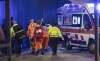 Medics wheel an injured person into an ambulance at the scene of an attack in Milan, Italy, Thursday Oct. 27, 2022. A man armed with a knife stabbed five people inside a shopping center south of Milan on Thursday. (LaPresse via AP)