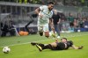AC Milan's Matteo Gabbia tries to tackle Chelsea's Reece James, left, during the Champions League group E soccer match between AC Milan and Chelsea at the San Siro stadium in Milan, Italy, Tuesday, Oct. 11, 2022. (AP Photo/Antonio Calanni)