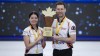 Team Einarson/Gushue skip Kerri Einarson, left, and third Brad Gushue pose with the trophy after defeating Team Sahaidak/Lott at the Canadian Mixed Doubles Curling Championship final in Calgary, Alta., Thursday, March 25, 2021. Gushue and Kerri Einarson face some nontraditional opponents in the inaugural Pan Continental championship starting Monday in Calgary. THE CANADIAN PRESS/Jeff McIntosh