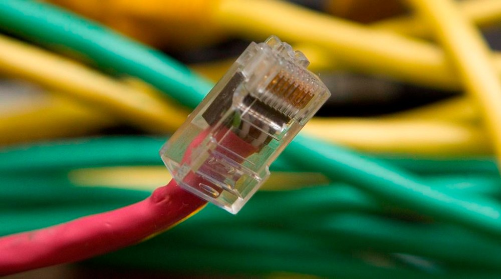 A network cable is seen in Ottawa, Thursday February 10, 2011. The federal cybersecurity centre says criminals who hold data for ransom are expected to use new techniques — such as threatening a target's partners or clients — to increase their chances of receiving payment. THE CANADIAN PRESS/Adrian Wyld