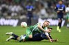 Werder's Mitchell Weiser, front, fights for the ball against Hertha's Suat Serdar during the Bundesliga soccer match between Werder Bremen and Hertha BSC at the Weserstadion in Bremen, Germany, Friday Oct. 28, 2022. (Carmen Jaspersen/dpa via AP)