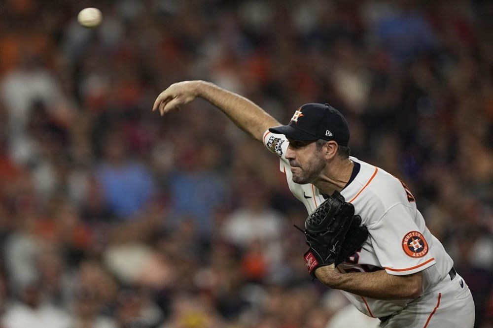 Houston Astros starting pitcher Justin Verlander works during the first inning in Game 1 of baseball's World Series between the Houston Astros and the Philadelphia Phillies on Friday, Oct. 28, 2022, in Houston. (AP Photo/David J. Phillip)