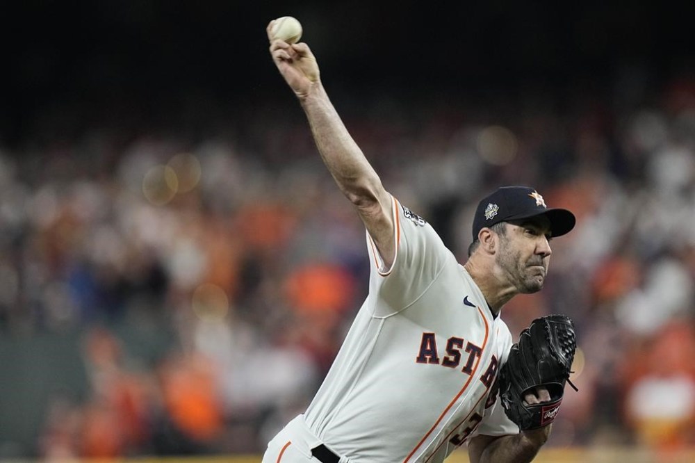 Houston Astros starting pitcher Justin Verlander throws during the first inning in Game 1 of baseball's World Series between the Houston Astros and the Philadelphia Phillies on Friday, Oct. 28, 2022, in Houston. (AP Photo/Eric Gay)