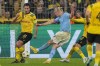 Dortmund's Mats Hummels blocking a ball shot by Manchester City's Erling Haaland during the Champions League Group G soccer match between Borussia Dortmund and Manchester City in Dortmund, Germany, Tuesday, Oct. 25, 2022. (AP Photo/Martin Meissner)