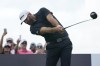 Dustin Johnson hits from the third tee during the final round of the LIV Golf Team Championship at Trump National Doral Golf Club, Sunday, Oct. 30, 2022, in Doral, Fla. (AP Photo/Lynne Sladky)