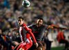 Atletico Ottawa's Sergio Camus Perojo (5) and Forge FC's David Choinière (7) battle for the ball during first half Canadian Premier League finals soccer action in Ottawa on Sunday, Oct. 30, 2022. THE CANADIAN PRESS/Justin Tang