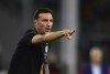 FILE - Argentina's coach Lionel Scaloni gives instructions to his players during a qualifying soccer match for the FIFA World Cup Qatar 2022 against Colombia at Mario Alberto Kempes stadium in Cordoba, Argentina, Tuesday, Feb. 1, 2022. (AP Photo/Gustavo Garello, File)