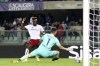 Verona goalie Lorenzo Montipo saves on Roma's Tammy Abraham during the Serie A soccer match between Hellas Verona and Roma, at the Marcantonio Bentegodi Stadium in Verona, Italy, Monday, Oct. 31, 2022. (Paola Garbuio/LaPresse via AP)