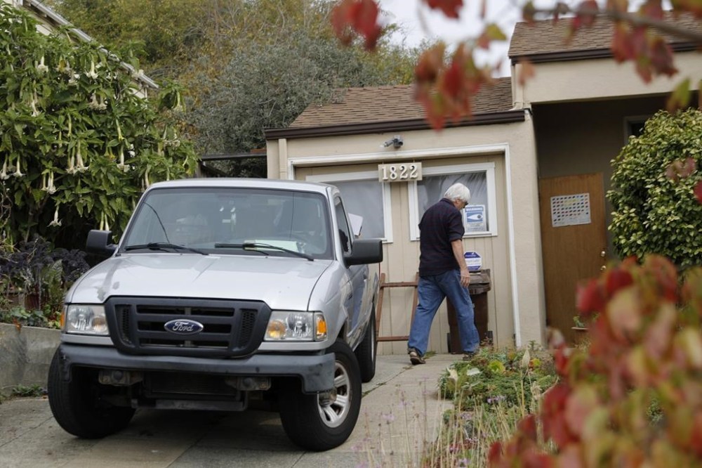 Frank Ciccarelli helps his friend and landlord of David DePape, Malcolm Lubliner, not pictured, remove DePape's belongings from a home in Richmond, Calif., Monday, Oct. 31, 2022. DePape, who was charged with attempted kidnapping and assault in an attack on U.S. House Speaker Nancy Pelosi's husband Paul, lived at the residence and worked for Ciccarelli as a deck builder. (Jane Tyska/Bay Area News Group via AP)