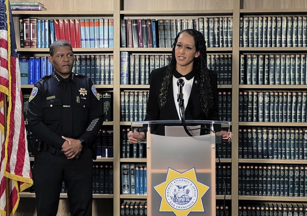San Francisco District Attorney Brooke Jenkins addresses reporters at a news conference with Police Chief William Scott standing next to her on Monday, Oct. 31, 2022, in San Francisco. Jenkins announced state charges against David DePape, including attempted murder. DePape is accused of breaking into the home of House Speaker Nancy Pelosi and attacking her husband with a hammer. (AP Photo/Terry Chea)