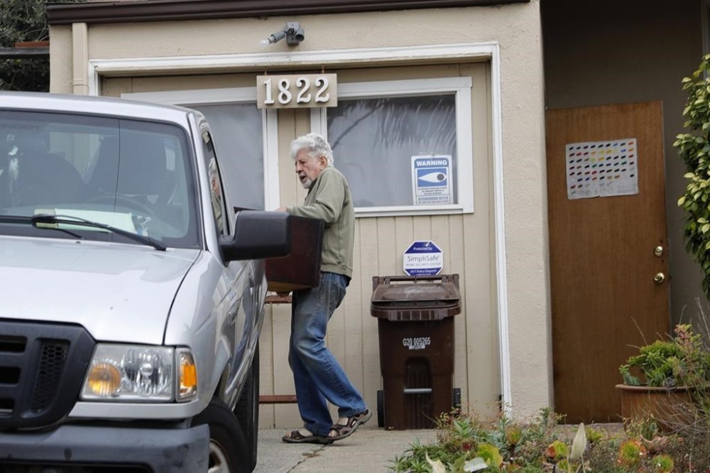 Malcolm Lubliner, the landlord of David DePape, removes DePape's belongings from a home in Richmond, Calif., Monday, Oct. 31, 2022. DePape, who was charged with attempted kidnapping and assault in an attack on U.S. House Speaker Nancy Pelosi's husband Paul, lived at the residence. (Jane Tyska/Bay Area News Group via AP)