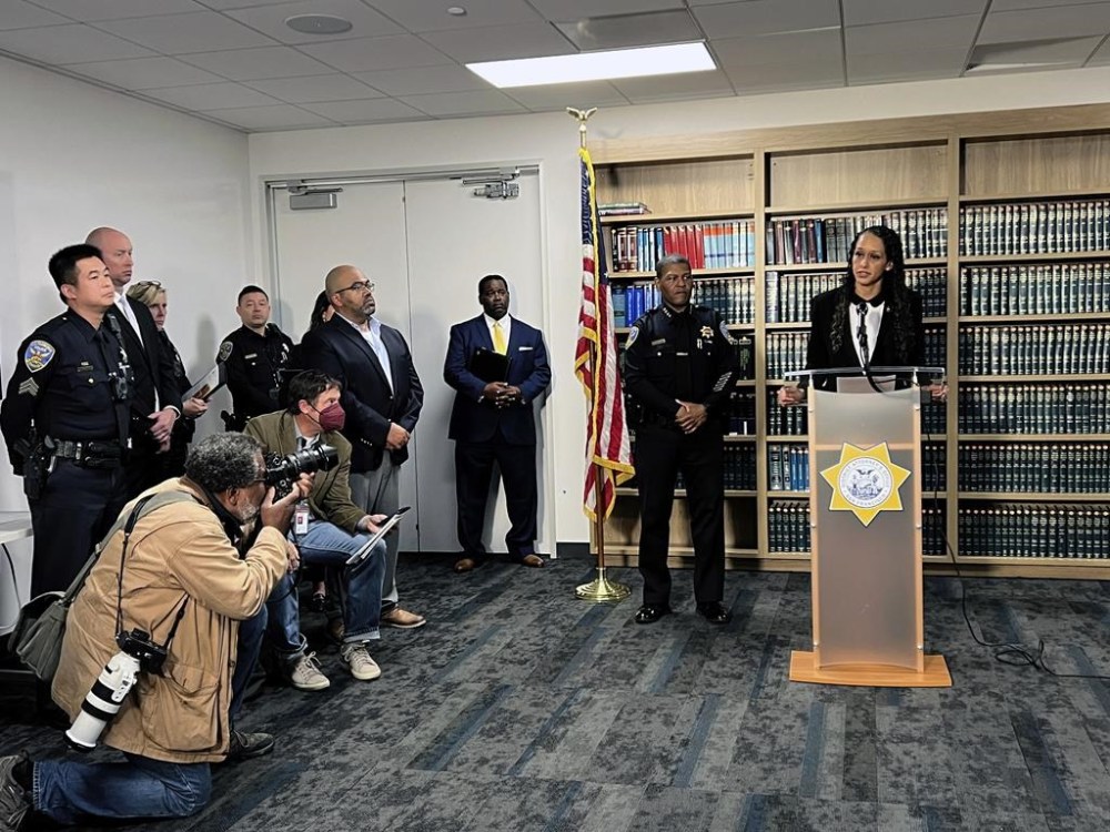 San Francisco District Attorney Brooke Jenkins addresses reporters at a news conference with Police Chief William Scott standing next to her on Monday, Oct. 31, 2022, in San Francisco. Jenkins announced state charges against David DePape, including attempted murder. DePape is accused of breaking into the home of House Speaker Nancy Pelosi and attacking her husband with a hammer. (AP Photo/Terry Chea)