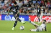 FILE - MX All-Star Álvaro Fidalgo (8) blocks a shot by MLS All-Star Taxiarchis 