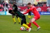 Canada's Scott Kennedy pushes Jamaica's Daniel Green during first half CONCACAF World Cup soccer qualifying action in Toronto on March 27, 2022. Kennedy has suffered a shoulder injury on the eve of the World Cup. SSV Jahn Regensburg, Kennedy's German club, said the 25-year-old from Calgary was injured in last Saturday's 3-0 loss to Rostock. THE CANADIAN PRESS/Frank Gunn