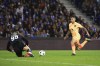 Porto's goalkeeper Diogo Costa blocks the ball in front of Atletico Madrid's Angel Correa during a Champions League group B soccer match between FC Porto and Atletico Madrid at the Dragao stadium in Porto, Portugal, Tuesday, Nov. 1, 2022. (AP Photo/Luis Vieira)