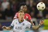 Brugge's Noa Lang, front, and Leverkusen's Edmond Tapsoba vie for the ball during the Champions League Group B soccer match between Bayer Leverkusen and Club Brugge at the BayArena in Leverkusen, Germany, Tuesday, Nov. 1, 2022. (AP Photo/Martin Meissner)
