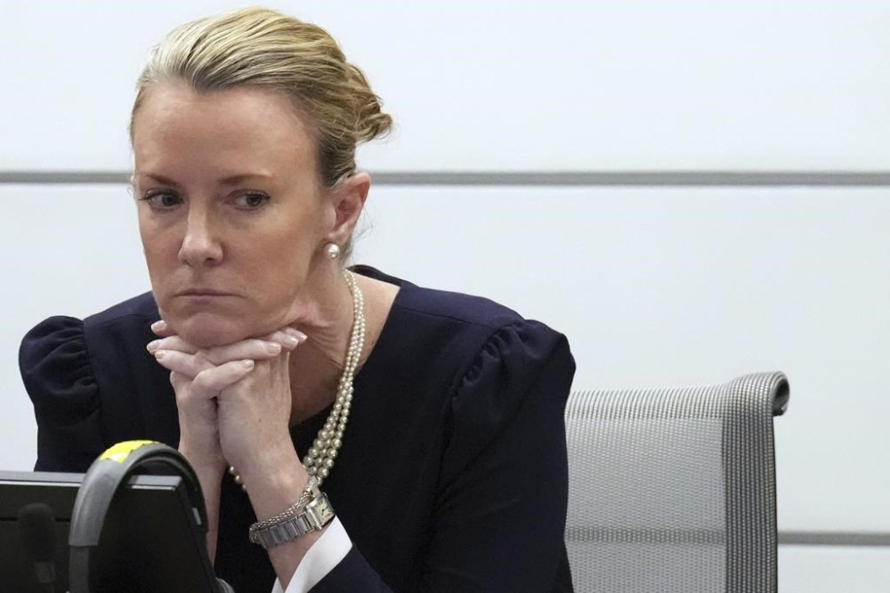 Assistant Public Defender Melisa McNeill sits at the defense table during a break in victim impact statements during the sentencing hearing for Marjory Stoneman Douglas High School shooter Nikolas Cruz at the Broward County Courthouse in Fort Lauderdale, Fla. on Tuesday, Nov. 1, 2022. Cruz was sentenced to life in prison for murdering 17 people at Parkland's Marjory Stoneman Douglas High School more than four years ago. (Amy Beth Bennett/South Florida Sun Sentinel via AP, Pool)