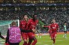 Frankfurt's Randal Kolo Muani, centre, celebrates after scoring his side's second goal during a Champions League group D soccer match between Sporting CP and Frankfurt at the Alvalade stadium in Lisbon, Tuesday, Nov. 1, 2022. (AP Photo/Armando Franca)