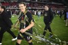 Portland Thorns FC forward Christine Sinclair (12) walks on the field with streamers after the NWSL championship soccer match against the Kansas City Current, Saturday, Oct. 29, 2022, in Washington.&nbsp;Sinclair, who led Portland to the NWSL championship on the weekend, is returning to the Thorns next season. THE CANADIAN PRESS/AP-Nick Wass