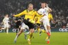 Dortmund's Julian Brandt, left, challenges Copenhagen's Denis Vavro during the Champions League soccer match between Copenhagen and Borussia Dortmund at Parken Stadium in Copenhagen, Denmark, Wednesday, Nov. 2, 2022. (AP Photo/Sergei Grits)
